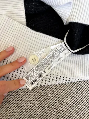 White knit sweater with spare buttons - like new