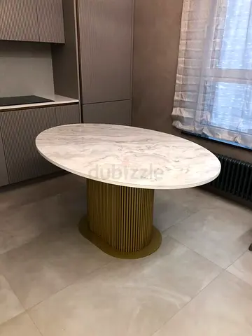 Modern oval or egg shape Marble Table with Elegant Fluted Pedestal and Minimalist Style