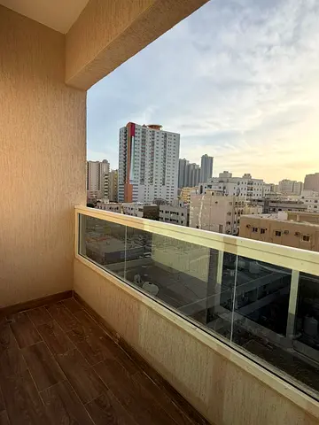 For monthly rent in Ajman: a one-bedroom apartment with a living room, balcony, two bathrooms, and parking. First occupancy Rent is 4300 AED includin