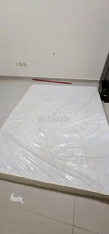 Queen-size mattress (wrapped in plastic) - good condition