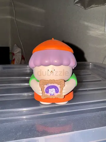 The pastel framed-character figure