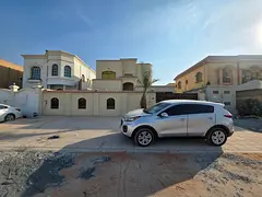 Villa for sale in Al Rawda 2, on a street and alley, 6 years old, next to a mosque, 6 rooms, a majli