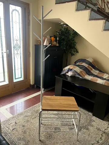Metal coat rack with wooden bench — good condition
