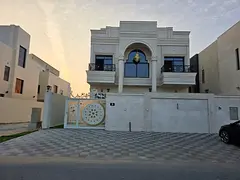 Villa for sale in Al Zahia, Ajman. 7 bedrooms, majlis, living room, spacious kitchen, and maid's roo