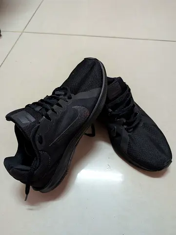 Nike Downshifter 8 running shoes in all-black.