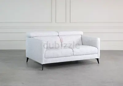 White linen upholstered loveseat with black legs