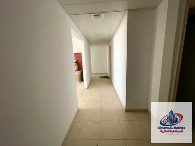 Luxurious three-bedroom apartment with a living room in Sharjah - Al Butinah area - very spacious - two balconies - prime location with excellent serv