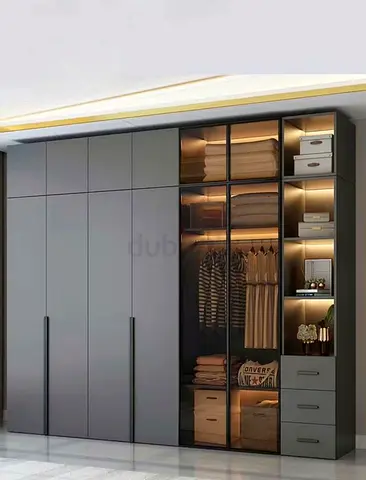 Modern Built-in Wardrobe with Glass Display and Integrated Lighting