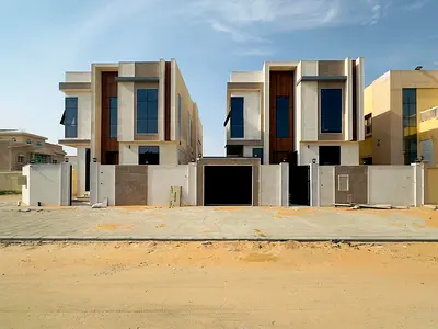 🏠Two new villas for sale in Al Rawda 1, Ajman – Prime location on two streets – 5 master bedrooms, majlis, living room, kitchenette, maid's room – Ce