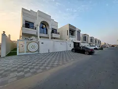Villa for sale in Al Zahia, Ajman. 7 bedrooms, living room, majlis, maid's room, and spacious ki