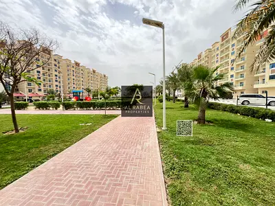 A fully integrated compound with a mosque, children's play area, and garden. The unit includes built-in wardrobes and central air conditioning. It boa