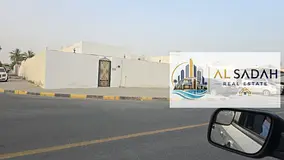 Corner house for sale in Al-Shahbaa, with 4 bedrooms, a living room, a majlis, and a kitchen. Area: