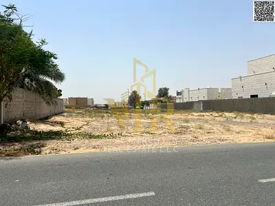 Prime residential land for sale in Al Hooshi, Sharjah, near the mosque and service road. 10,000 sq ft plot priced at AED 1,600,000, with ready-made bu