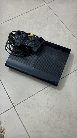 Sony PlayStation 3 Slim with wired DualShock controller - good working condition