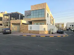 For rent a villa in Al Yasmeen, Ajman, 5 master bedrooms, a living room, a spacious kitchen, and a m