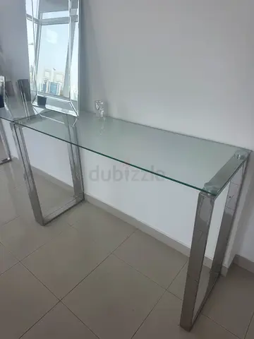 Two Glass Top Console Table with Stainless Steel Legs. Can be bought as a set or separately