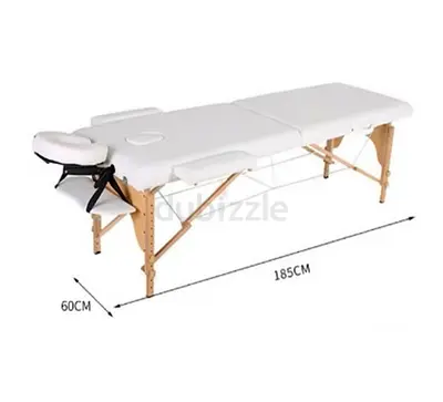 Portable massage / beauty bed in white color.