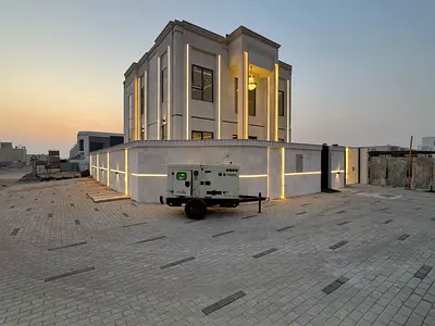 For sale, a villa in Al Helio 2, Ajman, 4 master bedrooms, a living room, a hall, and a corner