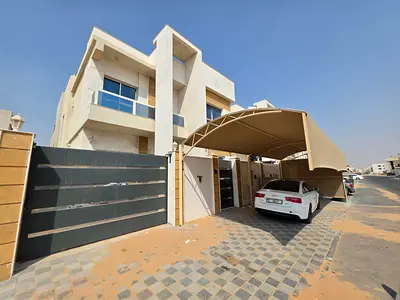 For rent a villa in Al Zahya, Ajman, 5 master bedrooms, a living room, a maid's room, and a spacious kitchen.