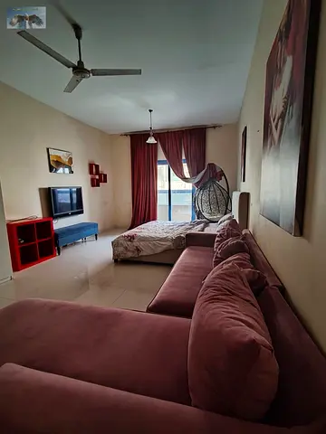 Furnished studio apartment with balcony for rent in Ajman Al Rawda 3 area Sheikh Khalifa Street ext