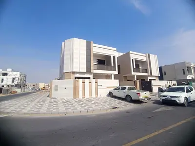 Corner villa for sale in Al Bahia. Ground floor, first floor, and roof. 6 bedrooms, living room, majlis, main kitchen, and preparation kitchen.