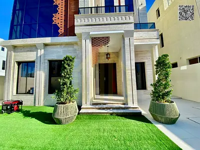Andalusian-style villa with luxurious finishes, a swimming pool, and a rooftop terrace on a 4300 sq ft plot. Freehold ownership for all nationalities.