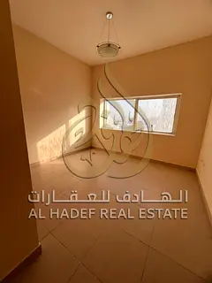 2BR apartment in Al Qasimia near Dubai exit and services, deferred security cheque, family-friendly