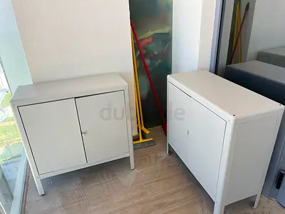 Pair of white metal storage cabinets - compact bedside/utility cabinets