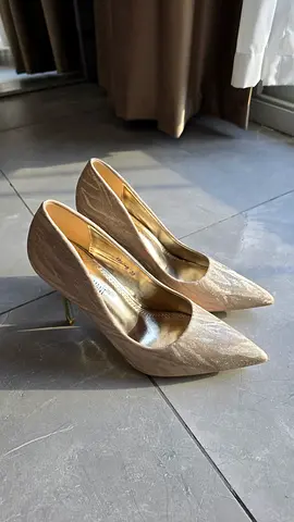 Gold pointed-toe heels