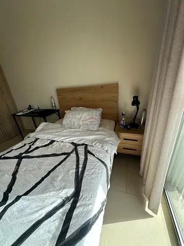 Single wooden bed frame with mattress and bedside table - good condition