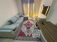 A monthly rental apartment with a large bedroom and a living room, featuring a spacious balcony and