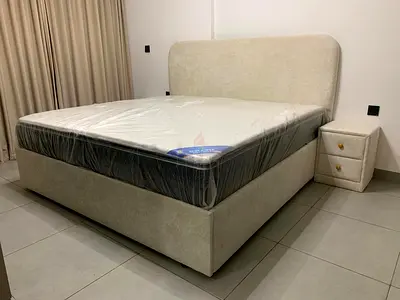 King-size upholstered bed with mattress (like-new)