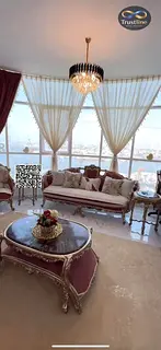 Two-bedroom apartment for sale in Al Waha Tower – Ajman Full and direct view of Ajman Creek