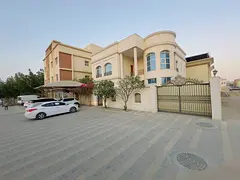 For rent in Rawda 1, a furnished villa with 5 master bedrooms, a majlis, two living rooms, a spaciou