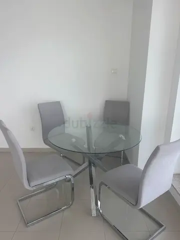 Glass Round Dining Table with 4 Grey Fabric Chairs