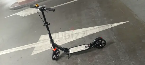 Used adult kick scooter with large rear wheel and rear brake - good condition