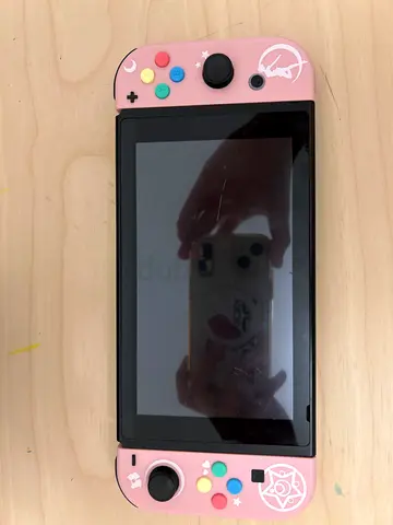 Nintendo Switch console with pink custom Joy-Con shells (used)