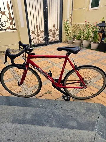 Red hybrid/road bike - lightweight frame, good condition