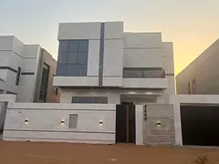 For sale in Al Helio 2, Ajman: a villa with 5 master bedrooms, a majlis, a living room, a spacious k