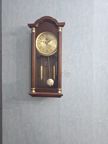 Vintage wooden wall pendulum clock with brass weights