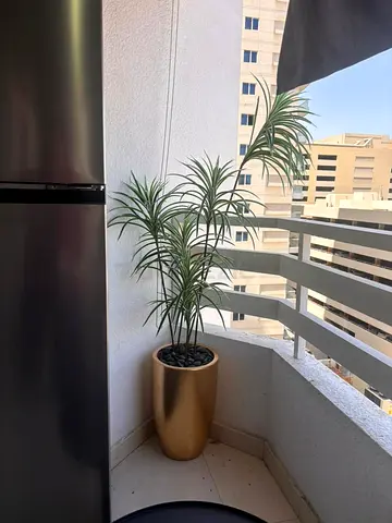 Urgent selling Tall Decorative Potted Plant (Artificial) in Gold Planter