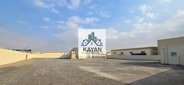 Industrial land for rent in Umm Al Quwain, 29,000 sq. ft with office, staff rooms & 35 kW power.