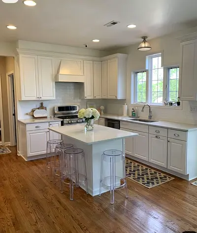 White Shaker Kitchen Cabinets with Island and Clear Acrylic Stools