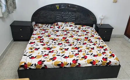 King Size Bed Frame with Carved Headboard, Matching Side Tables, 6 door wardrobe and Dressing table.