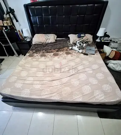 King leather bed frame with padded headboard in almost new condition. No damages or tear.