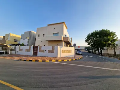 🏡 Villa for sale in Al Muwaihat 2 – Ajman, corner plot on two streets, 5 master bedrooms + majlis + living room, prime location