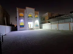 For sale, a villa in Al Rawda 3, Ajman, 5 rooms, a living room, a maid's room, and a spacious ya