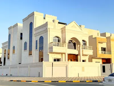 For rent in Al Helio 2, Ajman: a villa with 5 master bedrooms, a majlis, a corner living room, a kitchen, and a maid's room.