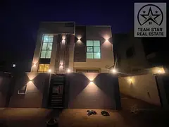 Villa for rent in Al Holew area, consisting of five master bedrooms, a majlis, a living room, and a