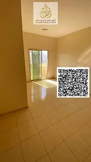 Two-bedroom apartment with a living room for rent in Al Rashidiya 2, Ajman, with two bathrooms and a